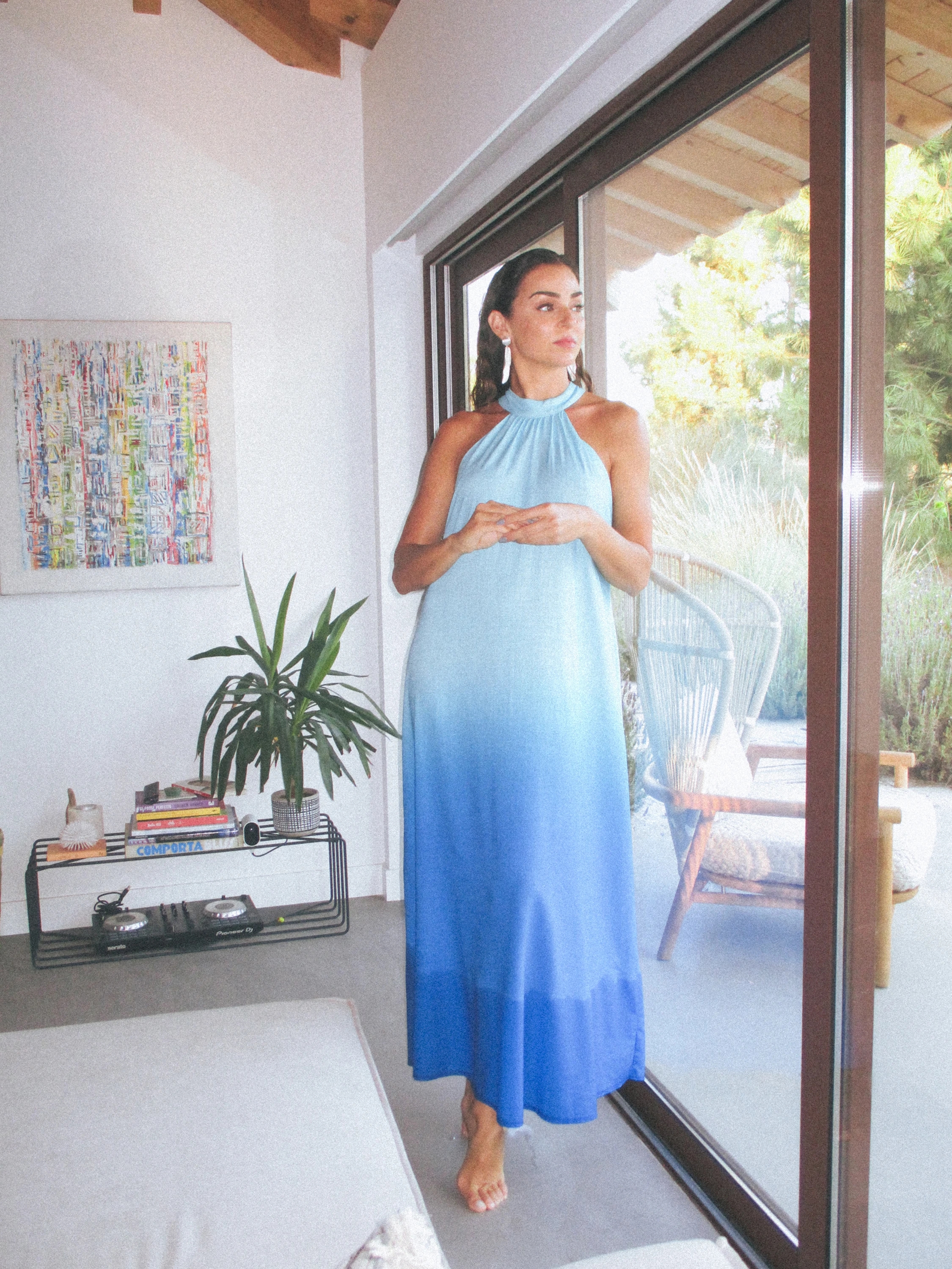 Vanessa Martins shines in her own creation, presenting a mesmerizing capsule collection of long gradient dresses that redefine warmth, style, and grace.